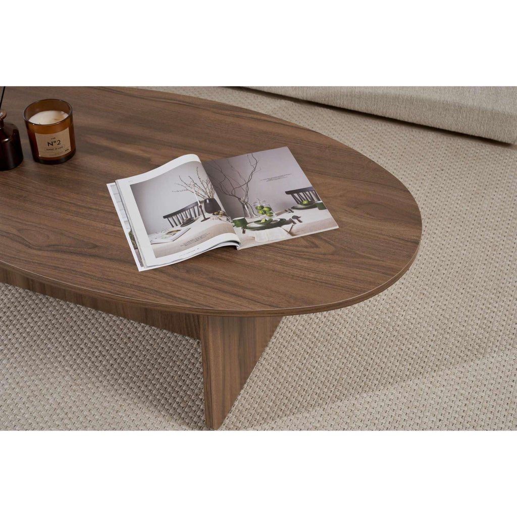 Oval dark wood coffee table with tapered legs and rounded tabletop edge.