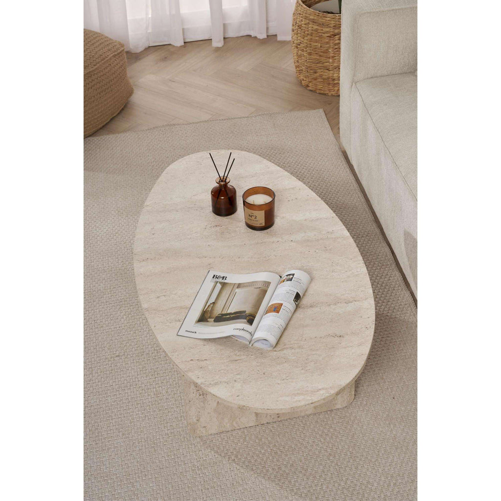 Oval coffee table with light travertine-style stone top and tapered legs.