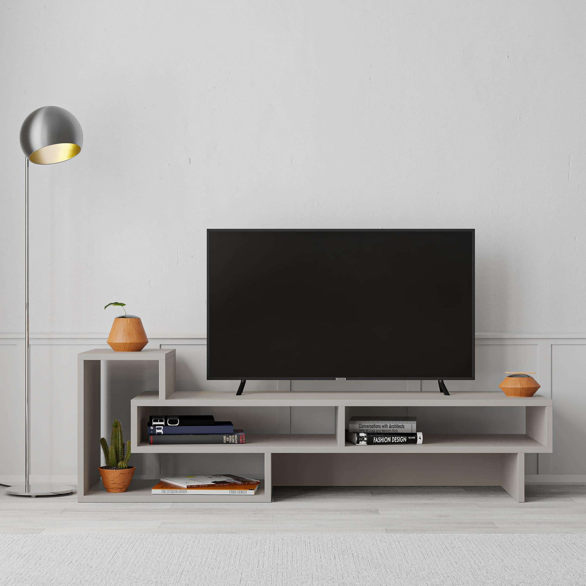 Modern TV stand with open shelves, light grey cabinet and media storage