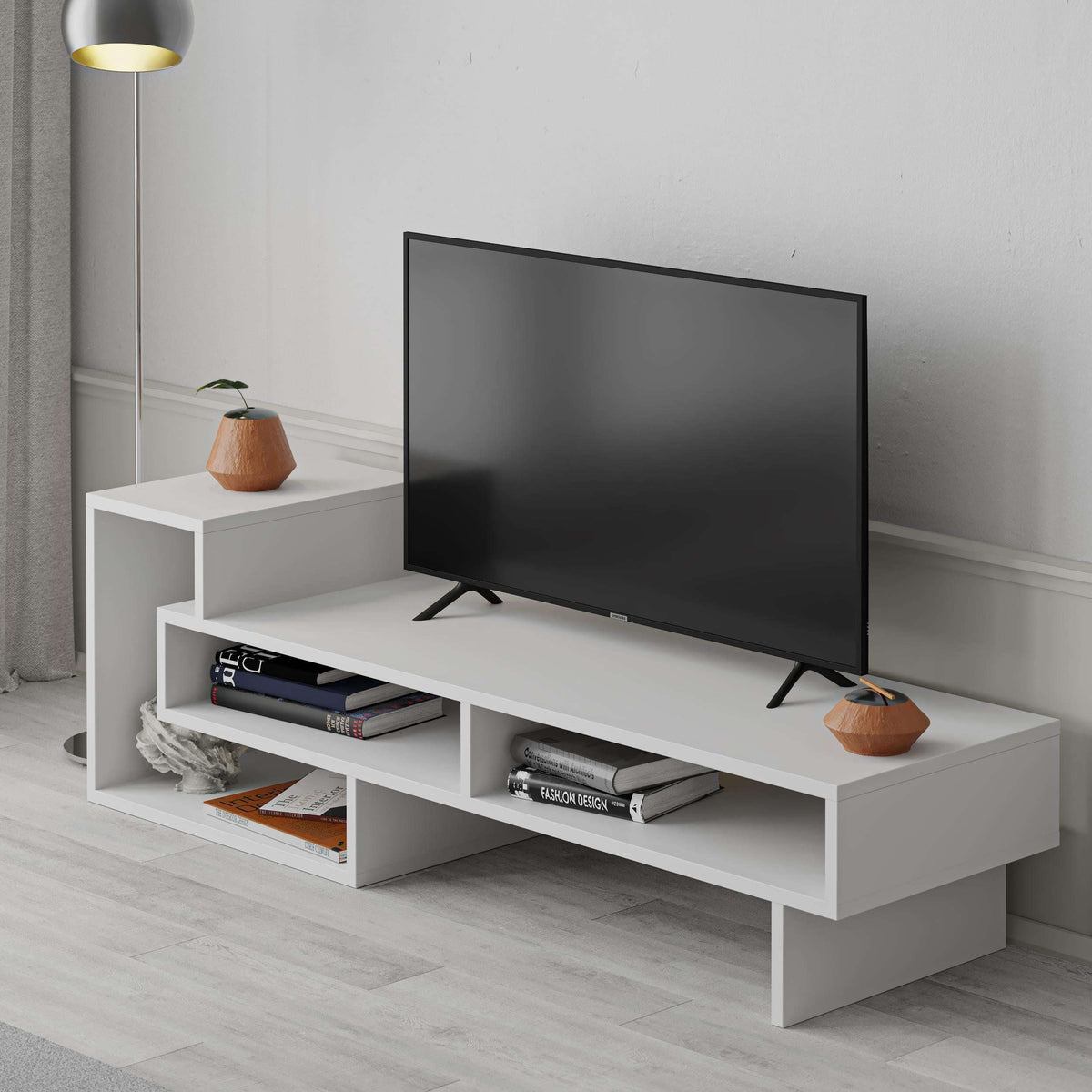 White modern TV stand with open shelves and TV support
