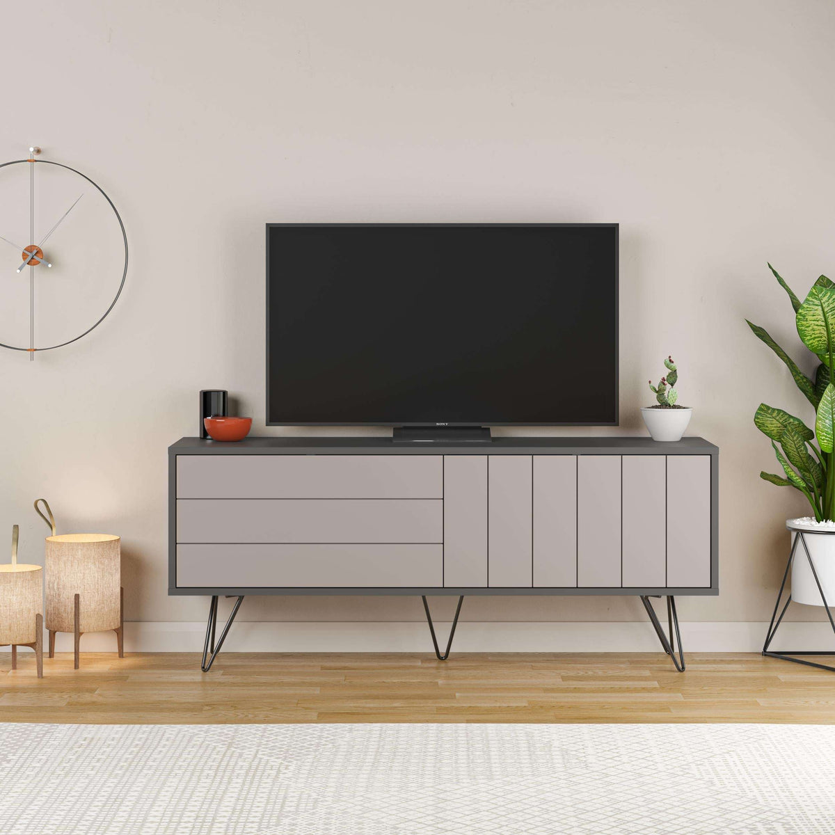 Modern TV stand with dark base, drawers and light cabinet doors on slim legs