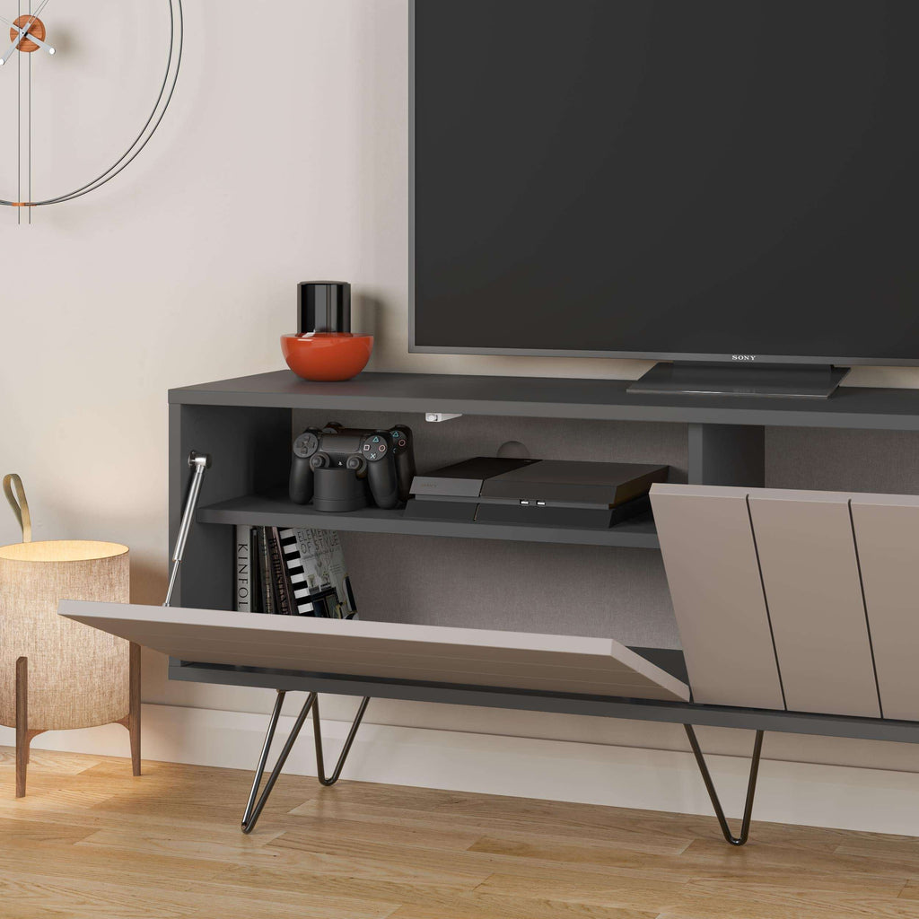 Close-up of open media shelves and drawer front on a dark TV stand
