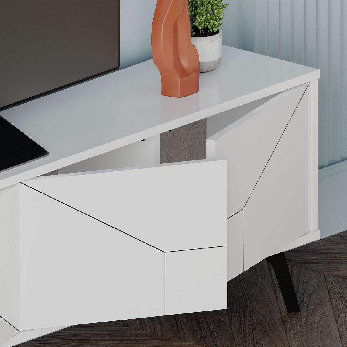 White modern TV stand with storage cabinet and hinged door panel detail