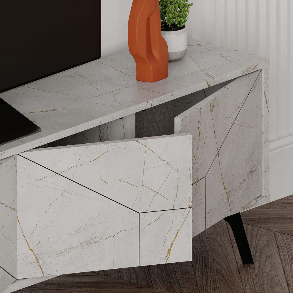 Marble-look drawer fronts and cabinet doors on white TV stand with black feet.