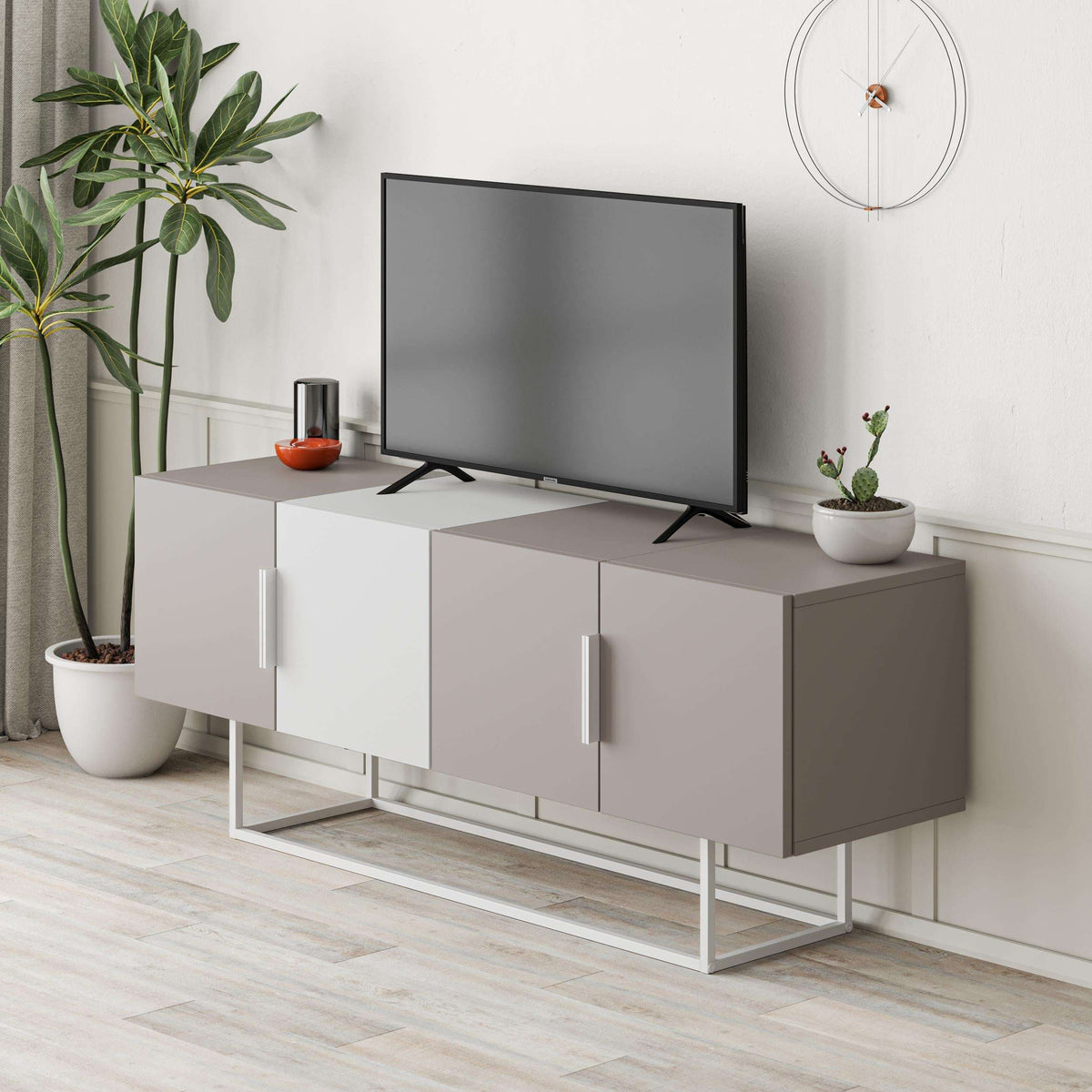 Modern TV stand with light wood panels, gray cabinet doors, and black legs