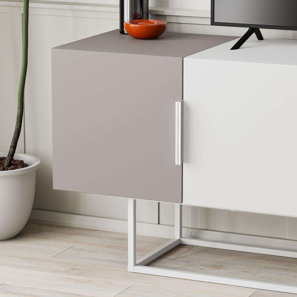 Close-up of light mocha cabinet door with silver handle on a white metal stand