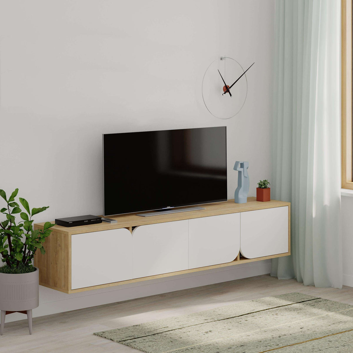 Floating TV stand with light wood top and two white drawers, curved cutout fronts