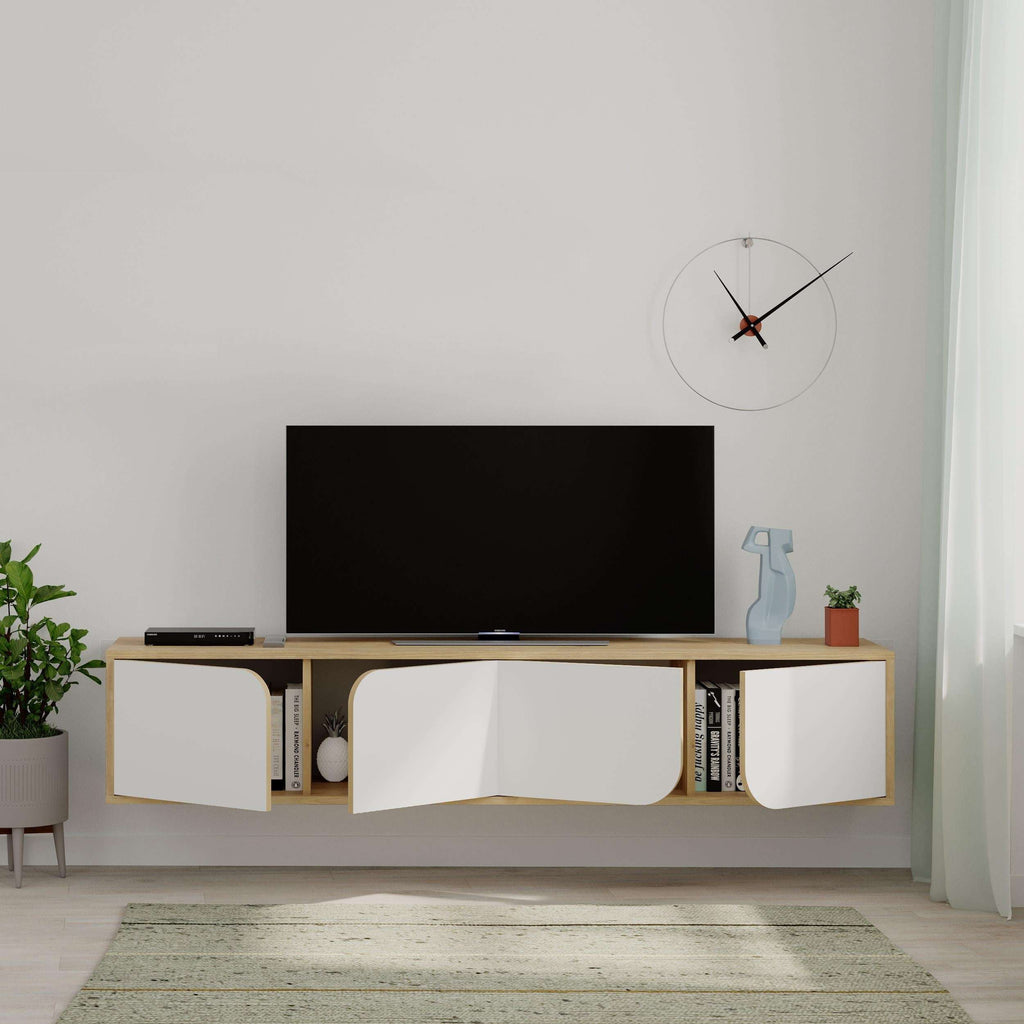 Modern floating TV stand with black TV, light oak frame, and three white storage doors