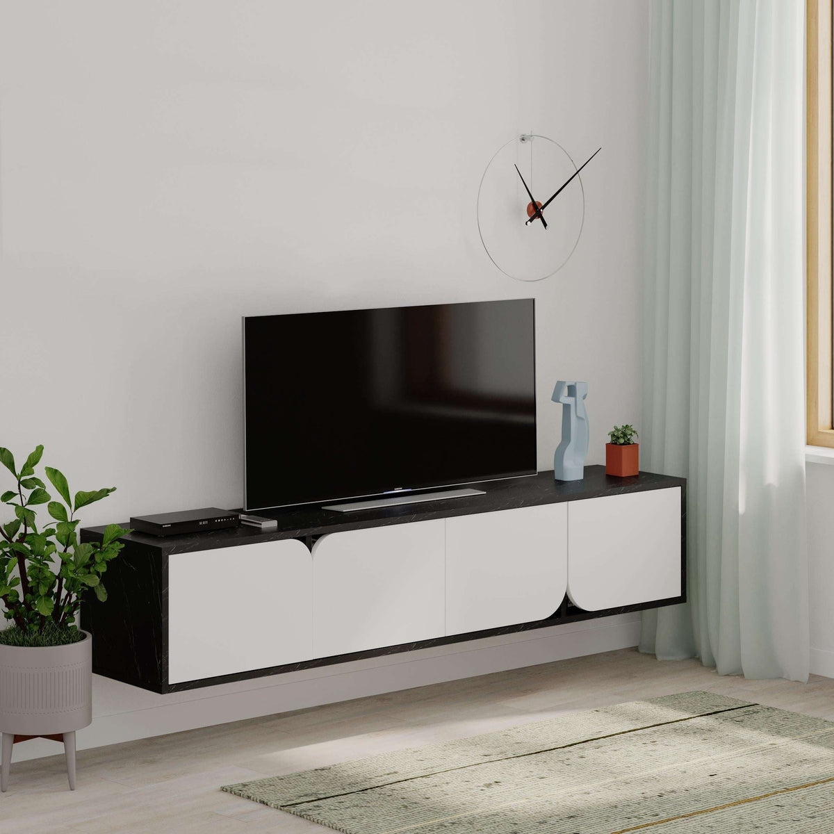 Floating TV stand with black top and white cabinet featuring arched drawer fronts