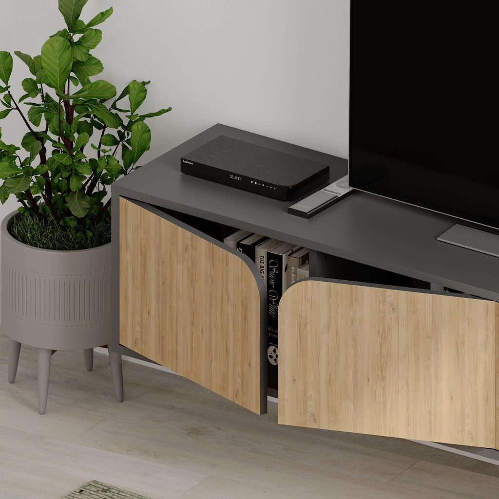 Floating TV stand with anthracite top and light oak cabinet doors over open storage.