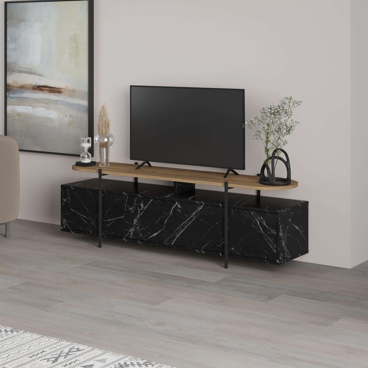 Modern multimedia TV stand with long tabletop, black marble-effect storage cabinets, metal frame.
