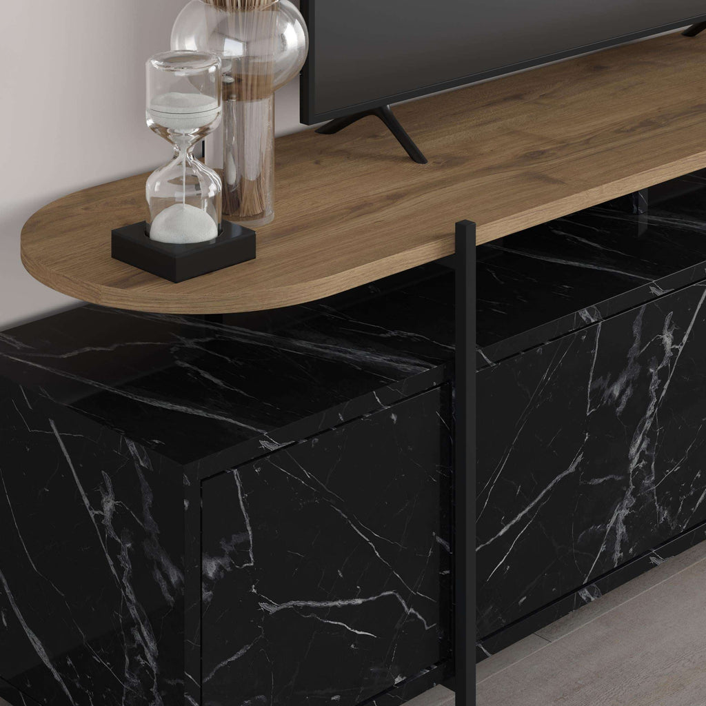 Close-up of TV stand with curved wood top and black marble-look storage cabinet