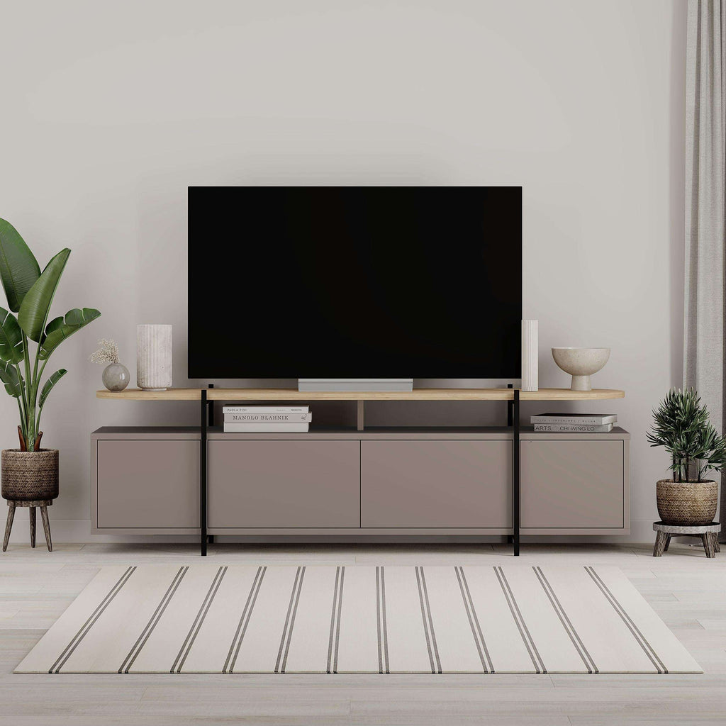 Modern TV stand with matte gray cabinet doors, open center shelf, and slim metal legs