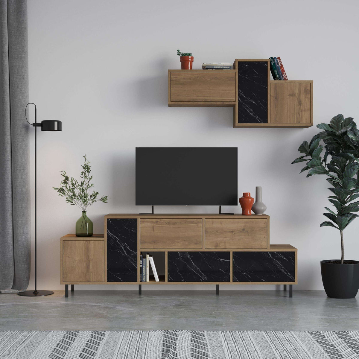 Modern TV stand with light oak body, black marble-effect panels, and storage cabinets