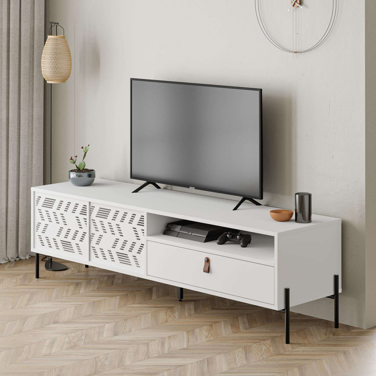 White TV stand with perforated side panels, open media shelf, and two drawers