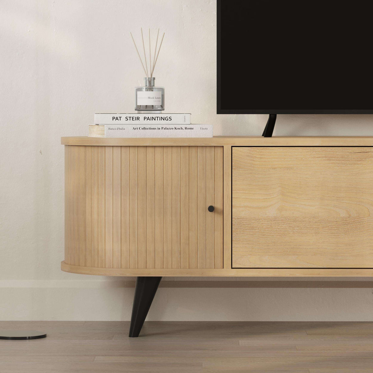 Oak TV stand section with ribbed cabinet door and round knob handle
