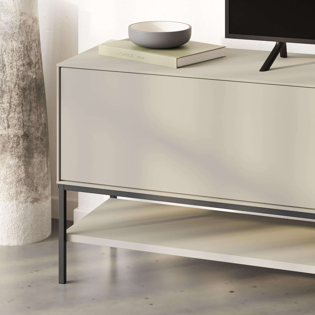 Amira TV unit in light sandstone with large front panel, open lower shelf, metal legs