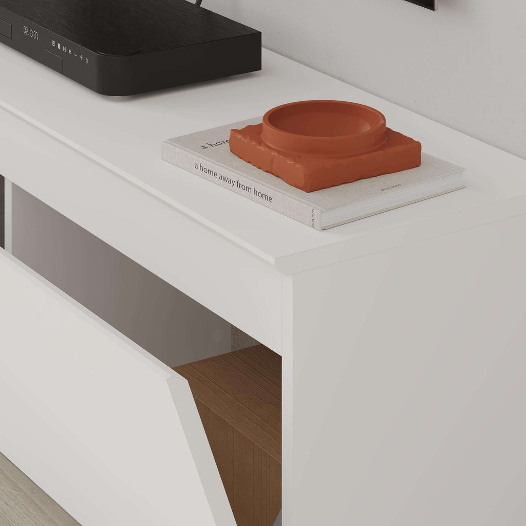 White TV low board with open storage compartment and orange decor on shelf