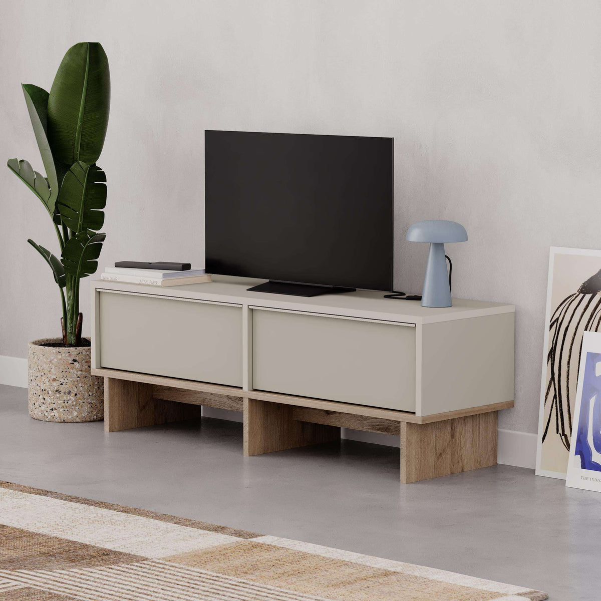 Sandstone TV console with two drawers, open center shelf, natural oak legs.