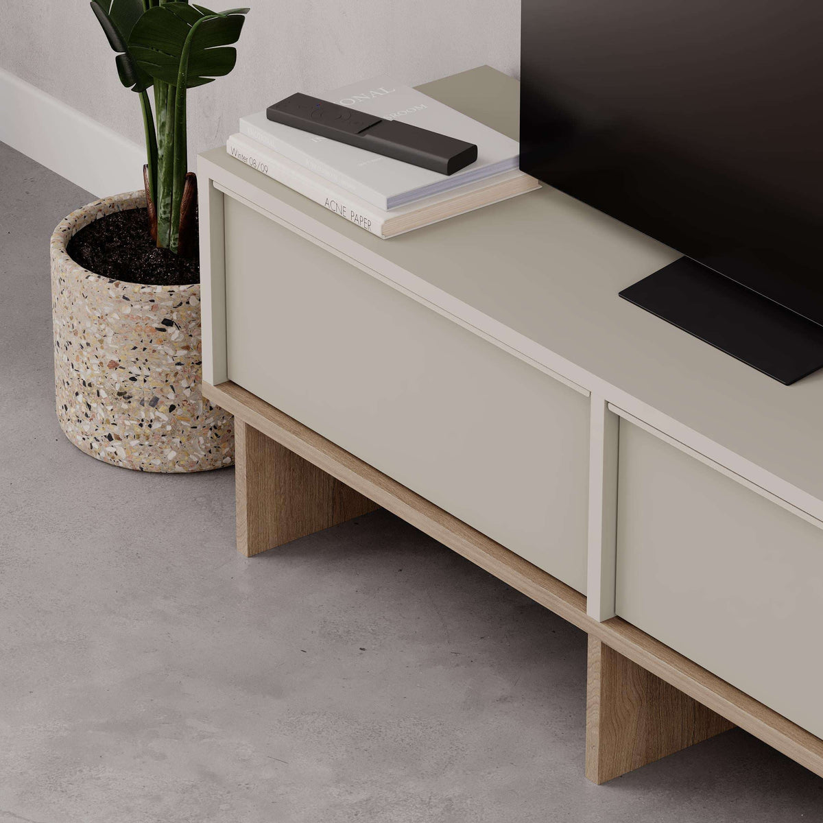Sandstone TV unit with storage drawers and open shelf, natural oak base and legs.