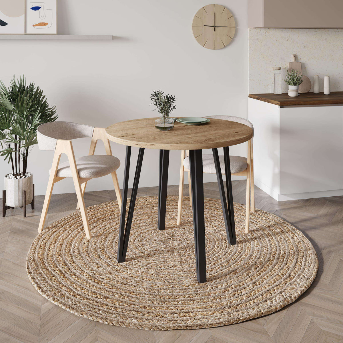 Round dining table with natural oak top and black tapered legs