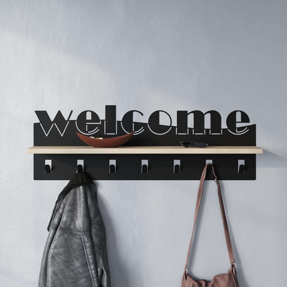 Wood-and-black hallway coat rack with hooks; coat and handbag hang on pegs