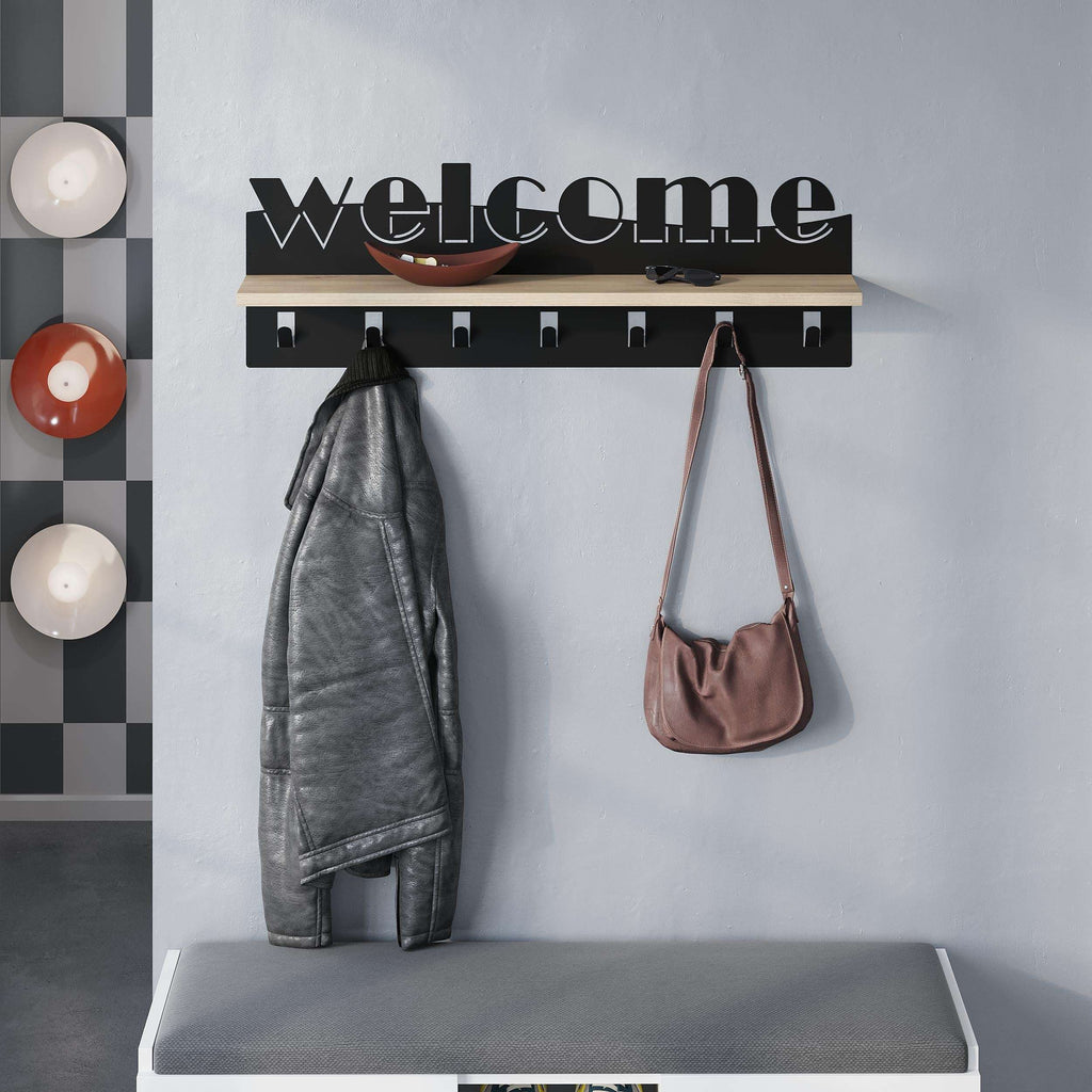 Wood-and-black coat rack with hooks; a jacket and handbag hang from the pegs