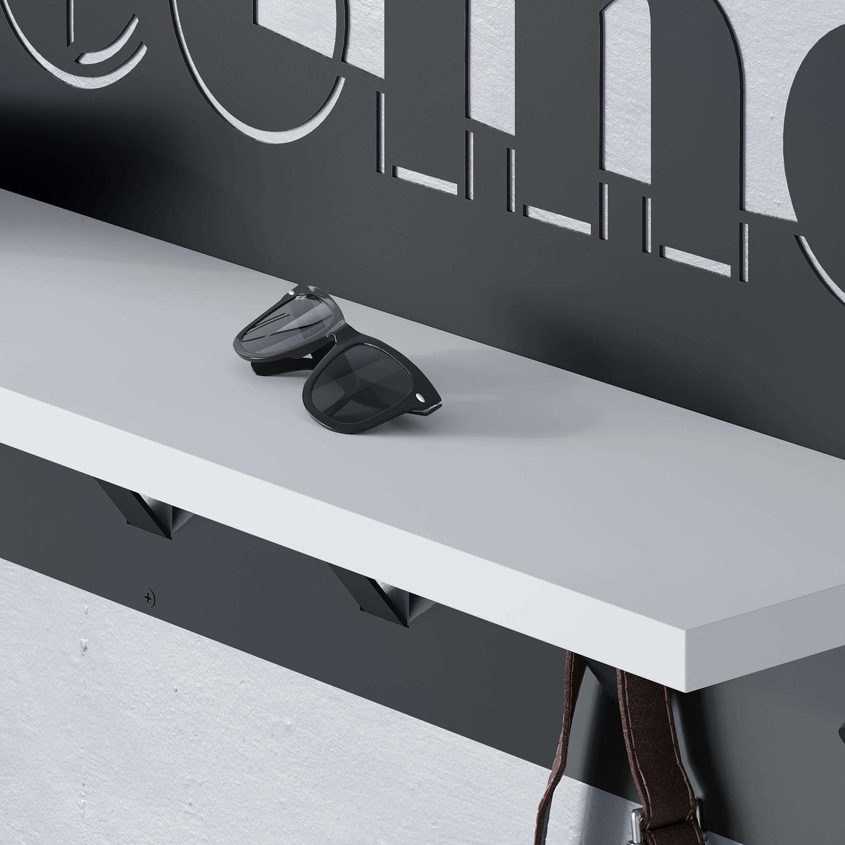 Wall-mounted coat hanger rack with hooks and shelf, close-up