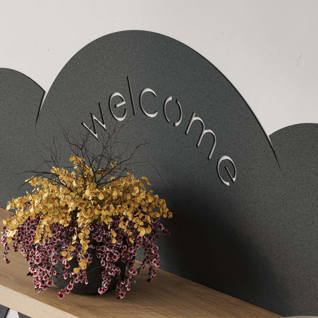 Dark cloud hanger back panel with welcome lettering and oak shelf edge