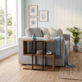 Stepped side table with open shelves, dark wood finish and black frame