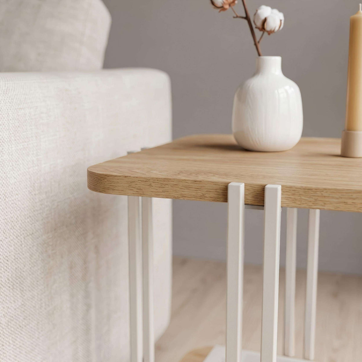 Two-tier side table with light wood top, white frame, and lower shelf.
