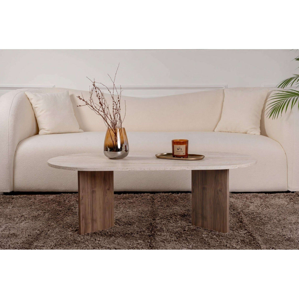 Oval coffee table with light stone top and light wood legs