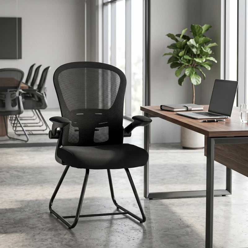 Black mesh-back reception chair with flip-up armrests, padded seat, metal base
