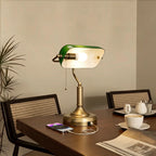 Green glass banker desk lamp with bronze stem and round base