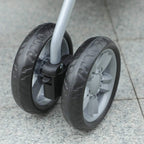 Stroller wheel close-up with black tire and gray plastic hub