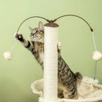 Beige cat tree with tall post and hanging toy balls, with a tabby cat playing