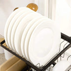 Black plate rack holding white stack of dinner plates over an over-sink stand