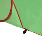 Green beach tent side panel with red frame and ground edge stakes
