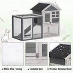 Two-tier wooden small animal hutch with wire mesh sides, grey roof, and ramp opening