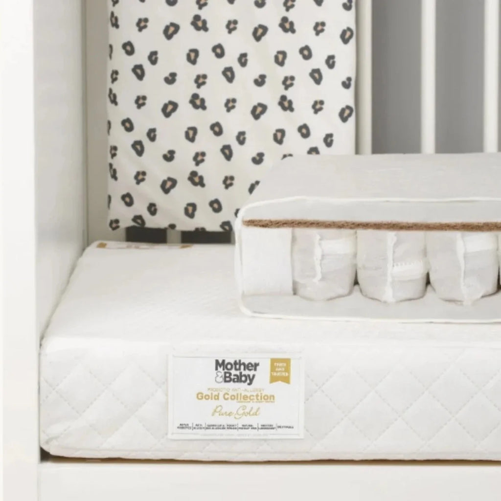 White cot mattress with quilted cover, gold label, pocket sprung edge support