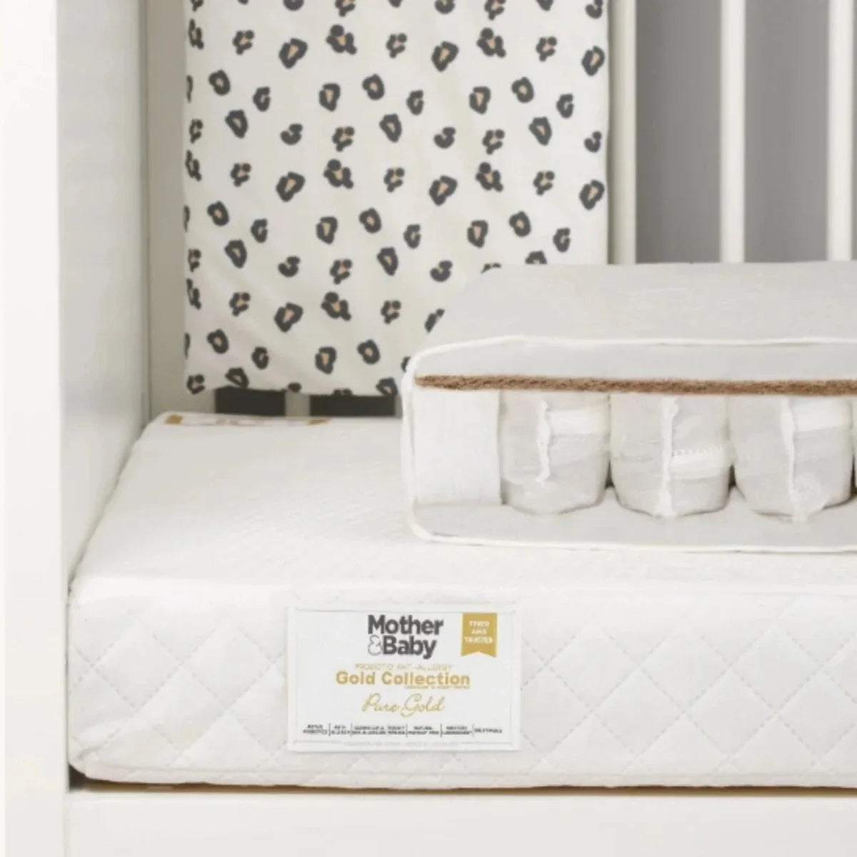White cot mattress with quilted cover, gold label, pocket sprung edge support
