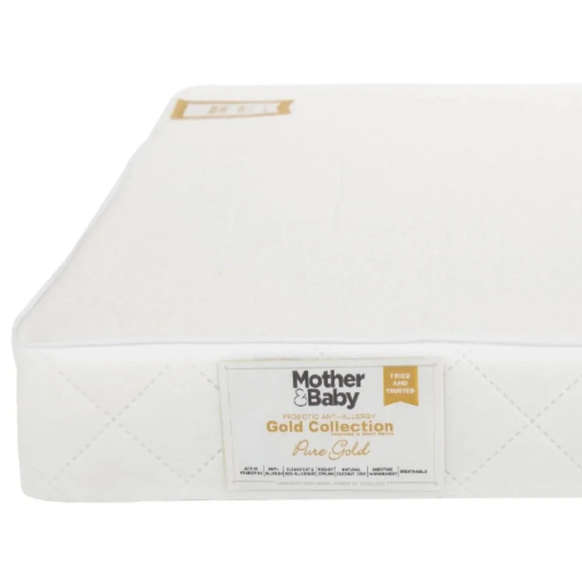 White cot mattress, top surface view with small corner label