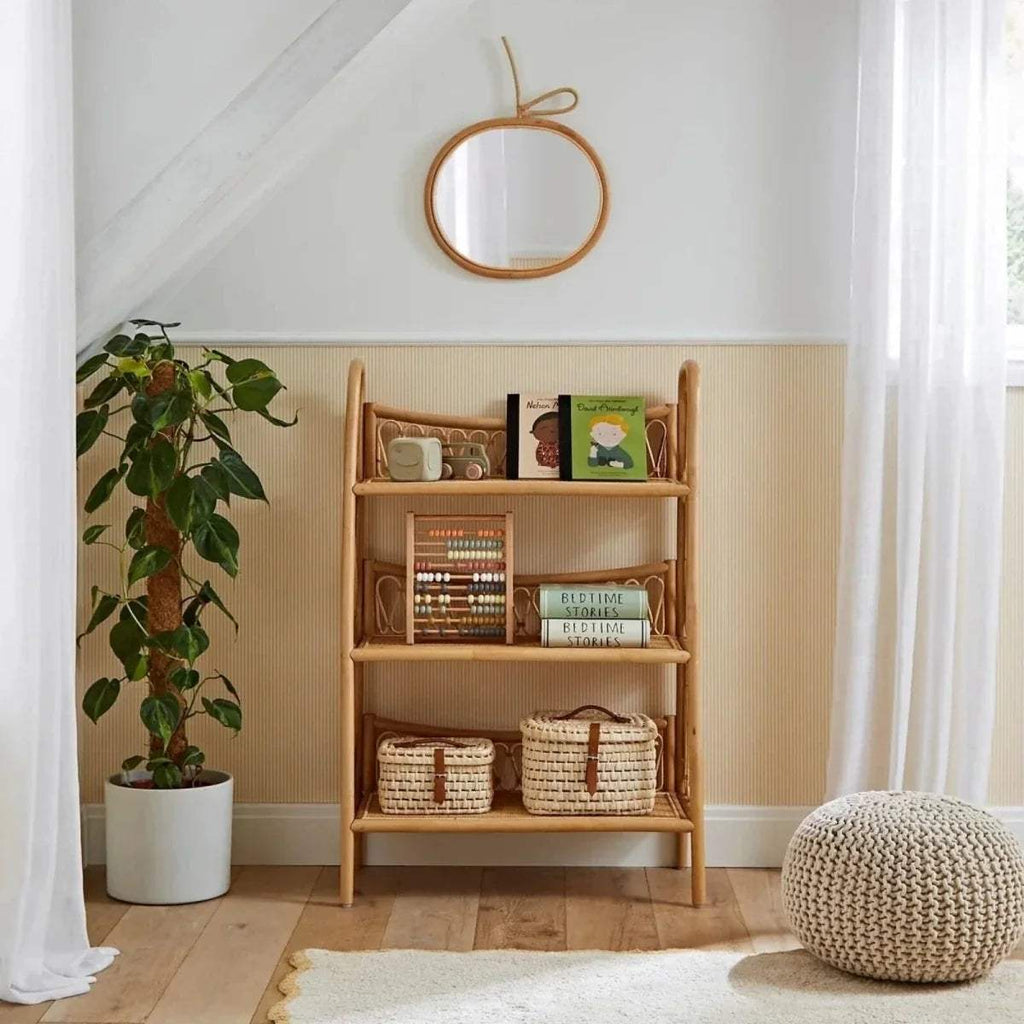 Rattan-style 3-tier shelving unit with open shelves for books and baskets
