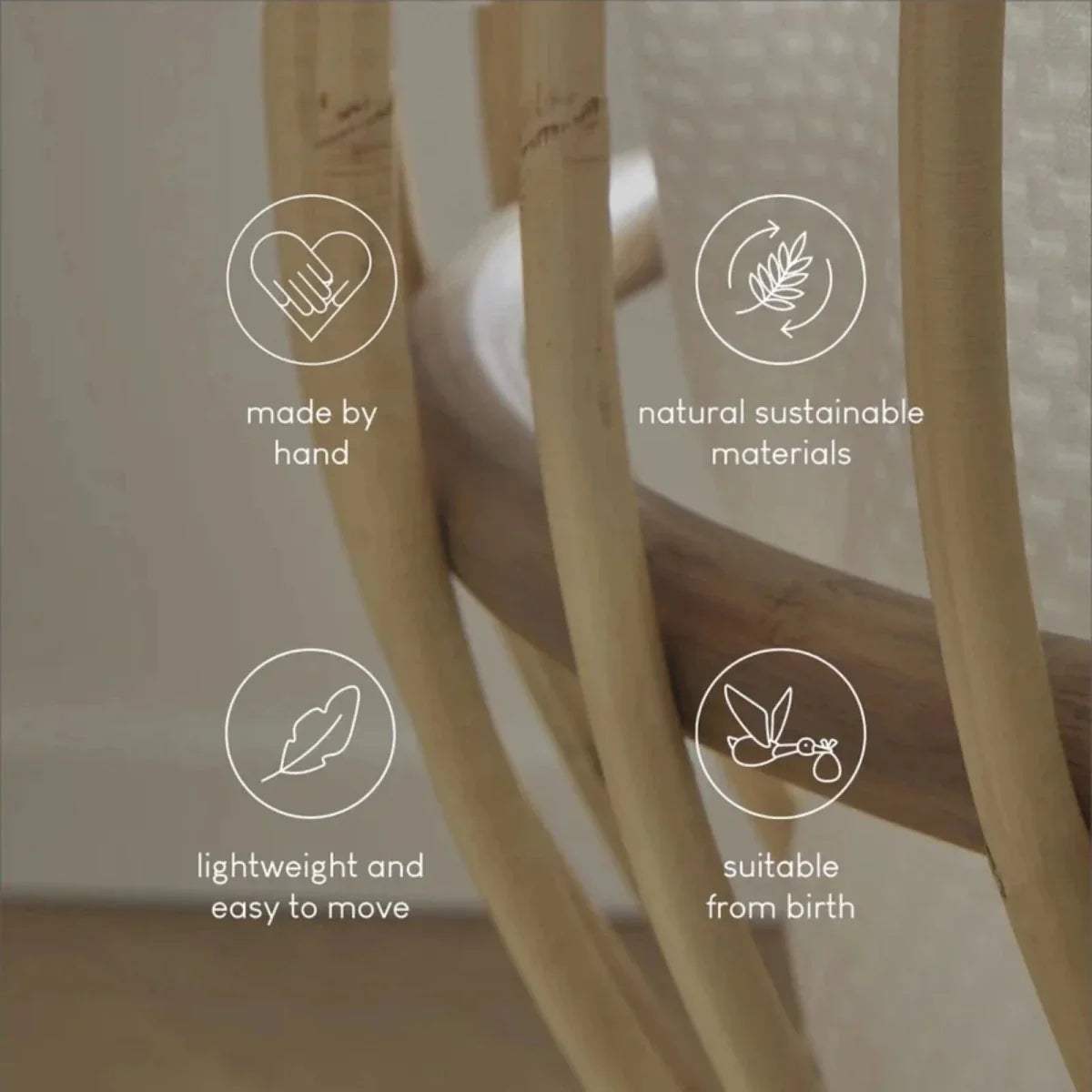 Natural rattan crib side with woven frame and light fabric lining