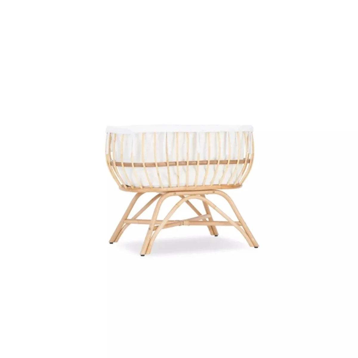 Natural rattan baby crib with white padded rim and woven basket base