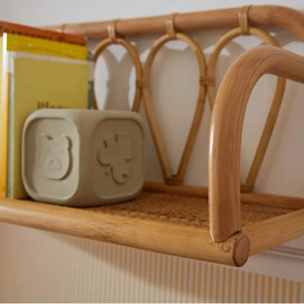 Rattan shelf with arched side supports and curved top railing