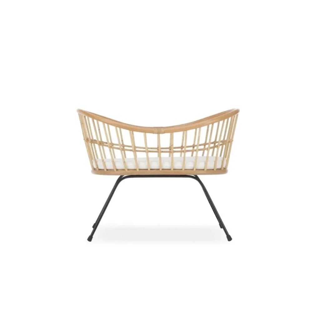 Rattan wave crib with curved headboard and foot, black metal stand legs