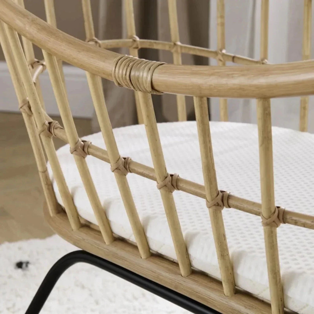 Rattan crib side panel with woven lattice and rounded top rail