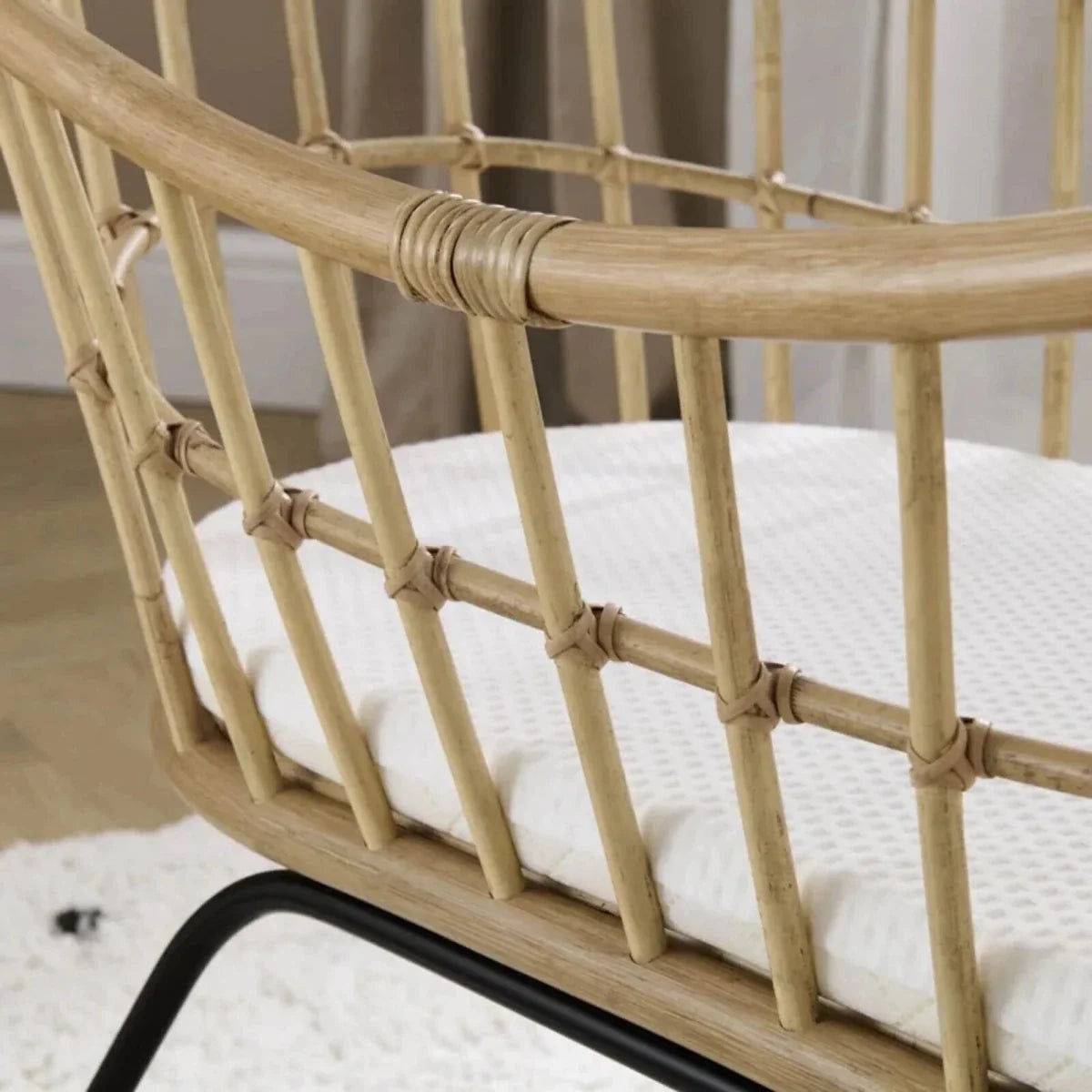 Rattan crib side panel with woven lattice and rounded top rail