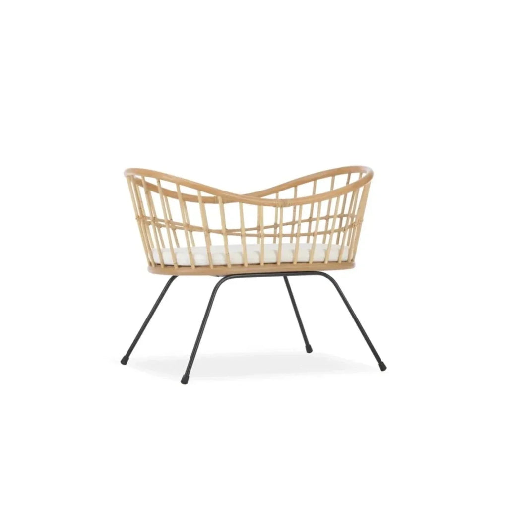 Rattan wave crib front view with curved headboard and black metal stand